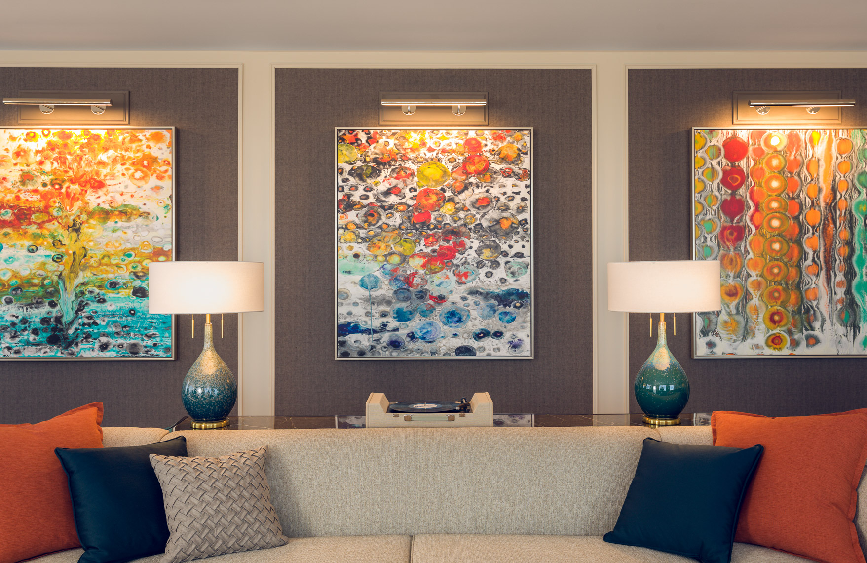 living room with abstract art over sofa