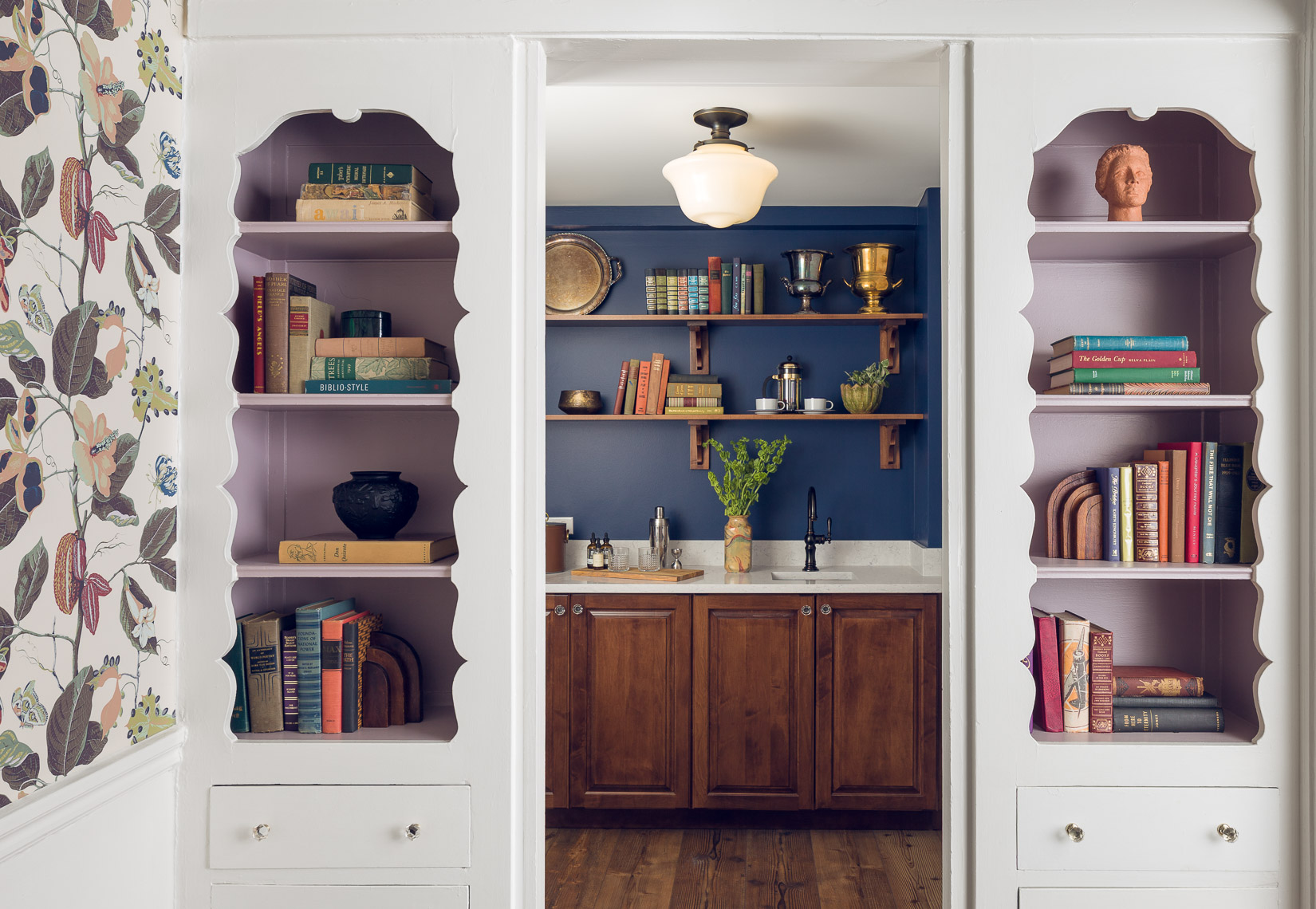 wet bar with white shelving and purple and blue wall color